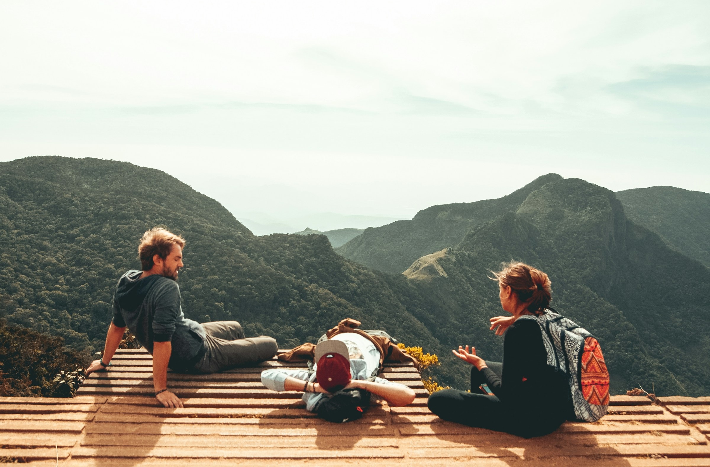 Friends overlooking Sri Lanka's mountain landscape